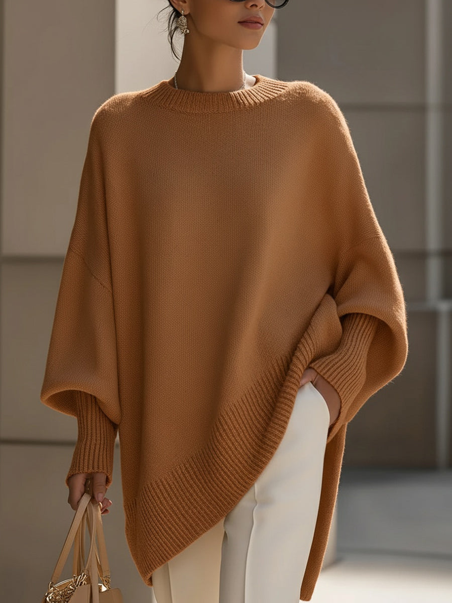 Chic women's autumn fashion oversized cape sweater, elegant poncho style with comfortable batwing sleeves.