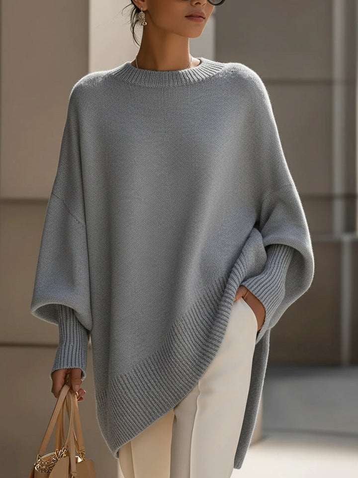 Stylish women's sweater: an elegant oversized cape, poncho-style with flattering batwing sleeves. Great for layering.
