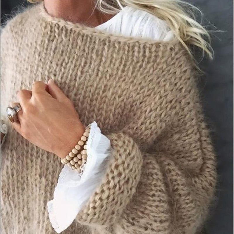 Women's oversized crocheted knit sweater in a cozy, loose fit, perfect for autumn fashion and casual comfort.