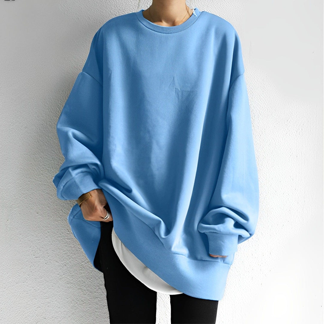 Everyday comfort in this women's oversized sweatshirt featuring dropped shoulders & a cozy, relaxed silhouette.