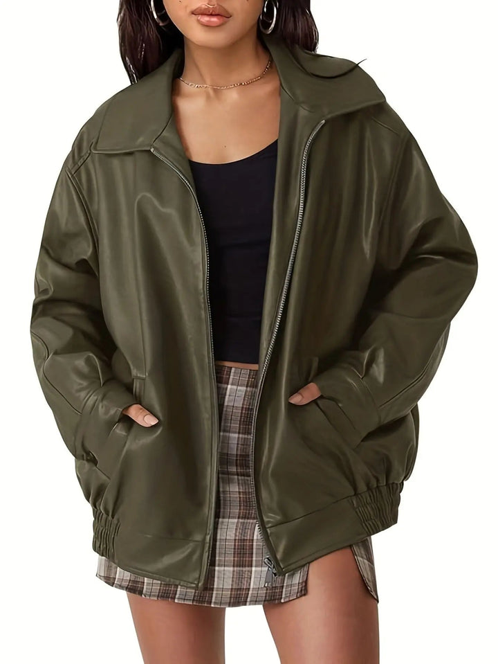 Stylish women's black faux leather bomber jacket, oversized design, perfect for a casual fall look.