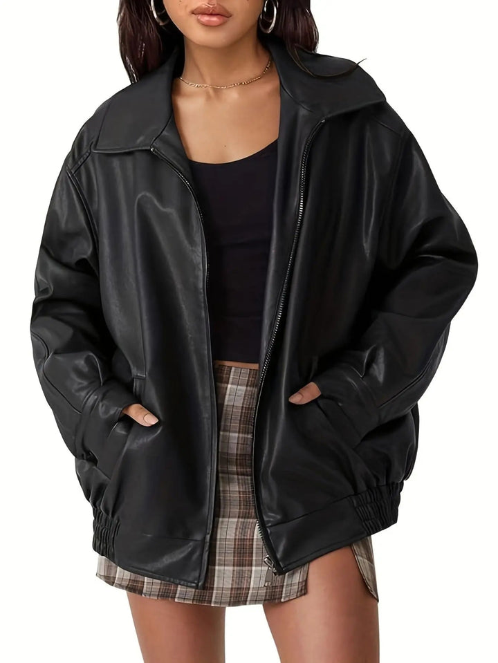 Versatile black faux leather oversized bomber jacket for women, a must-have for fall and spring fashion.