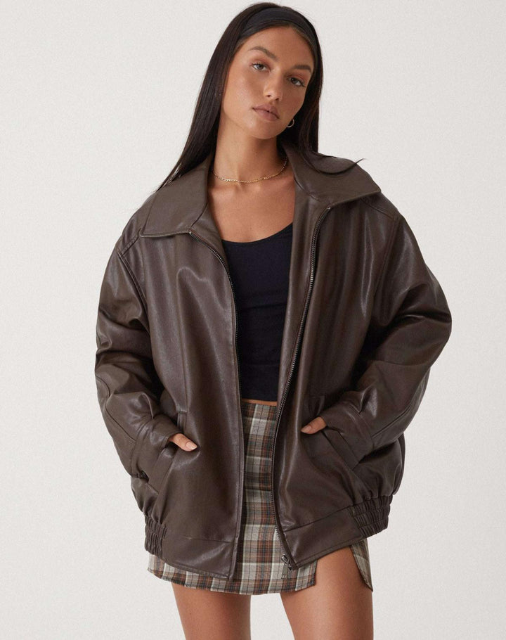 Women's oversized faux leather bomber jacket in rich brown, perfect for casual fall streetwear.