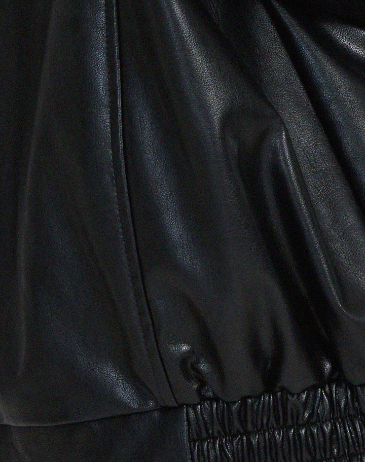 Two women's oversized faux leather bomber jackets, one brown and one black, for versatile fall styling.