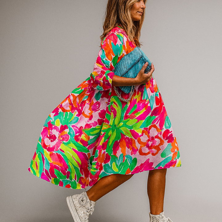 Women's oversized floral print midi dress with puff sleeves, perfect for summer casual or brunch.