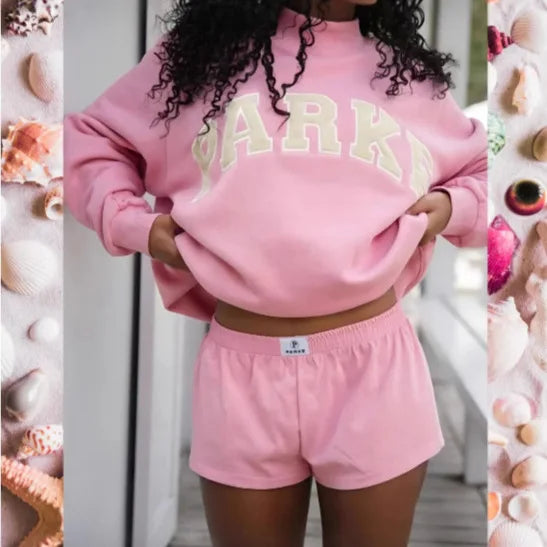 Women's oversized graphic sweater with a unique print for cozy comfort and casual wear.
