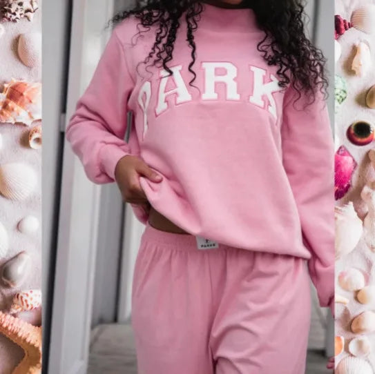 Comfortable oversized graphic print sweater for women, featuring a cozy crew neck design.