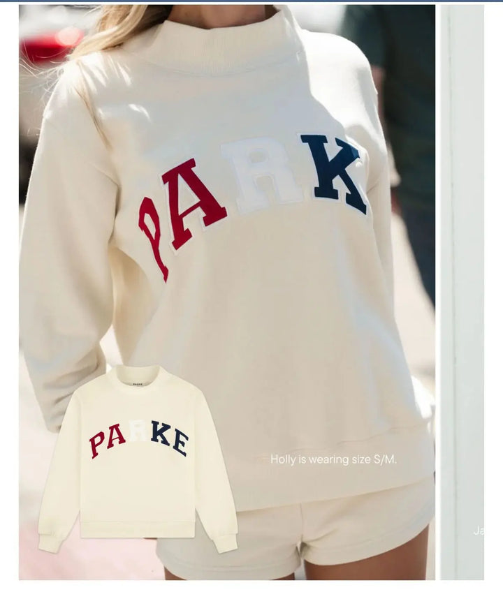 Soft long sleeve women's graphic sweater, an oversized crew neck top for ultimate comfort.
