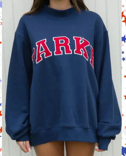 Cozy fashion women's oversized sweater with a bold graphic design and comfortable fit.