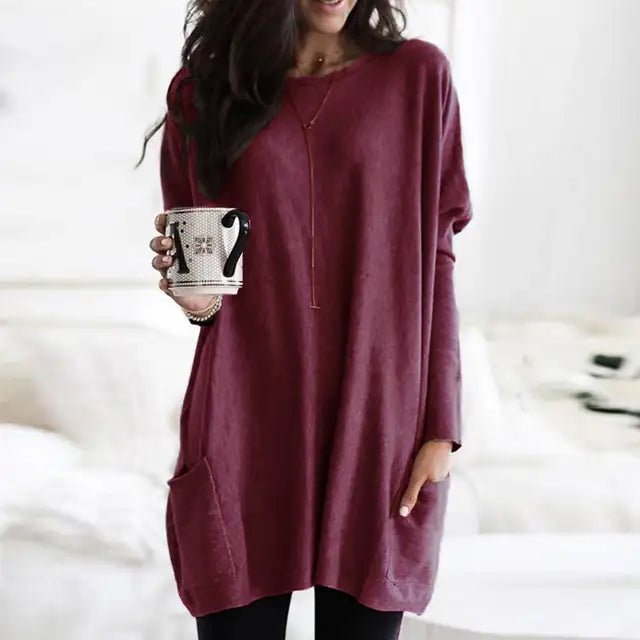 Women's oversized long sleeve tunic top with functional pockets, perfect for casual, comfortable everyday wear.
