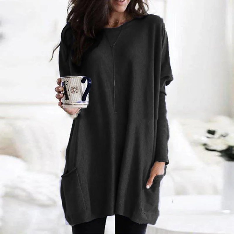 Chic women's oversized casual tunic top with long sleeves and discreet pockets, versatile style.