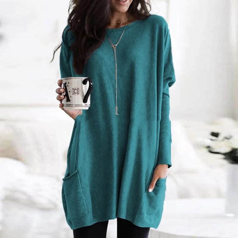 Essential women's casual oversized long sleeve tunic with easy-access pockets, comfortable & chic.
