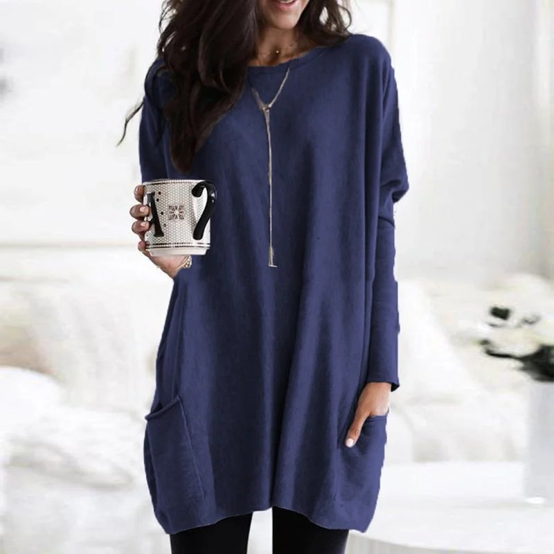 Graceful women's oversized long sleeve tunic top, featuring a soft fabric and practical pockets.