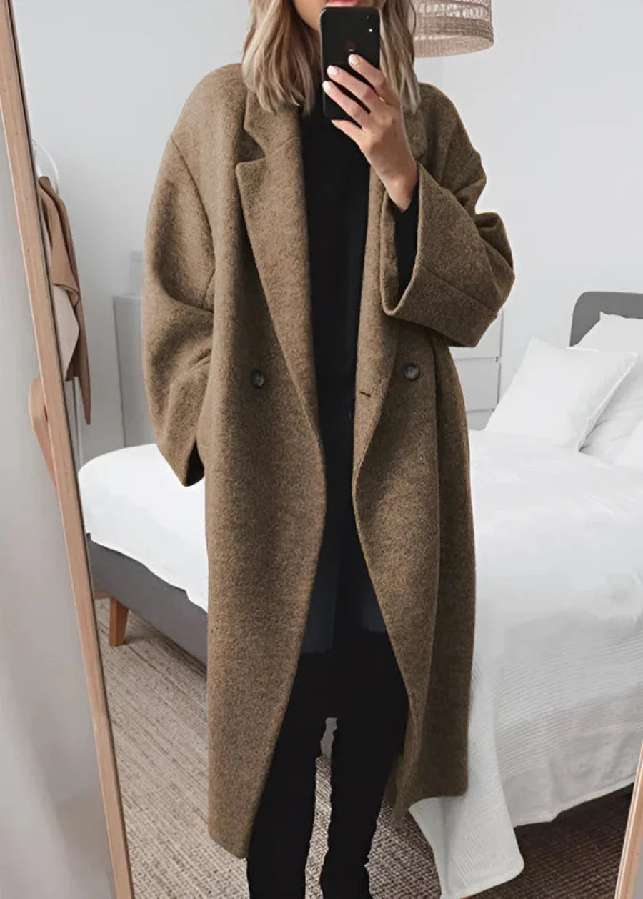 Versatile women's oversized maxi winter coat, ideal for elegant layering. Classic, warm outerwear for any winter fashion.