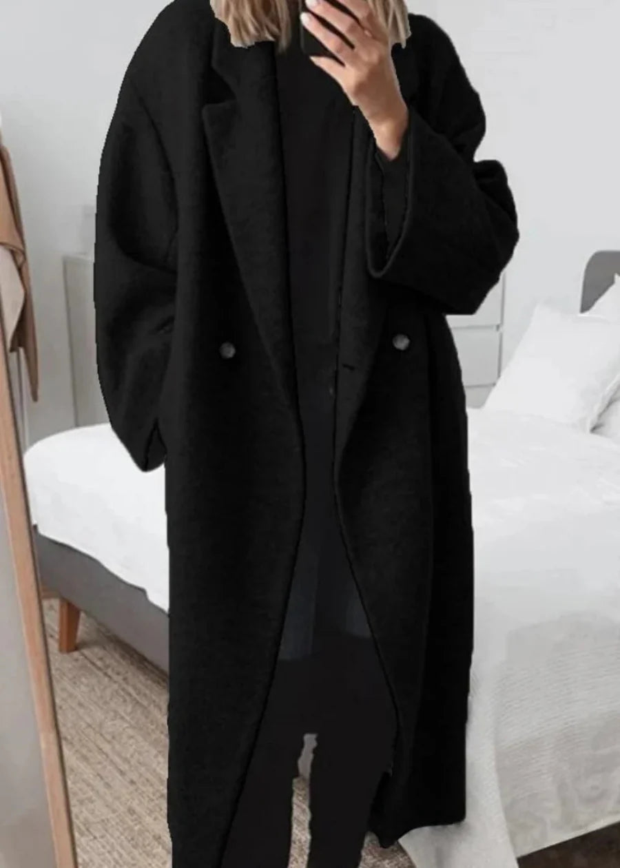 Close-up of a cozy women's oversized maxi winter coat fabric, highlighting its luxurious warmth and classic style.