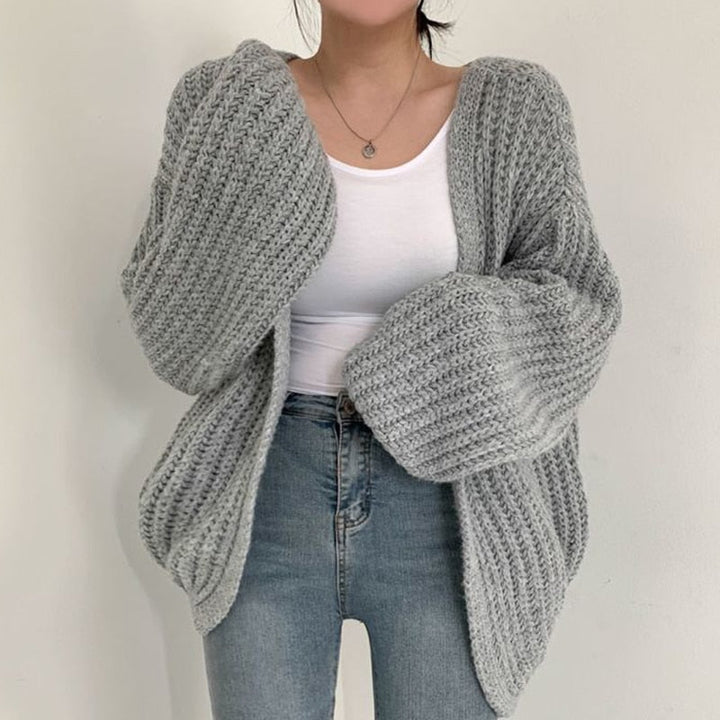 Comfortable women's oversized knit sweater, an open-front cardigan for versatile cold-weather styling.
