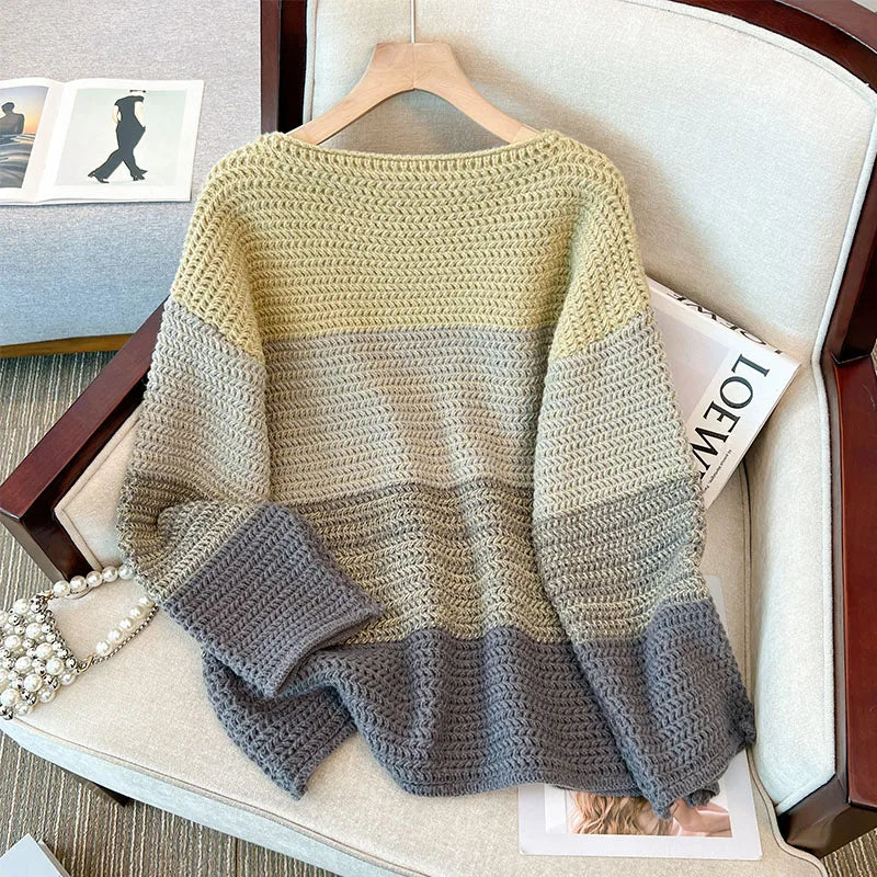 Comfortable women's oversized sweater featuring unique patchwork design. Perfect for cozy style and casual female apparel.