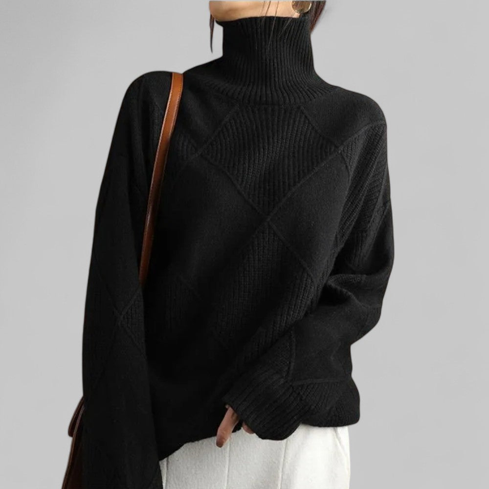 Women's oversized patterned turtleneck sweater in chunky knit, perfect for cozy winter fashion.