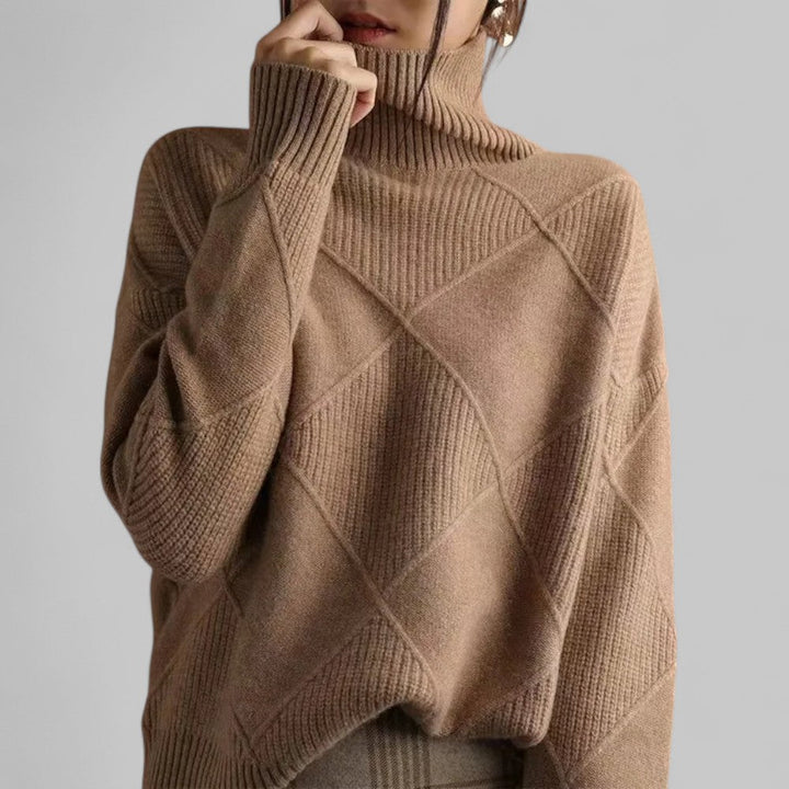 Warm women's knitwear: oversized turtleneck sweater with a unique pattern, ideal for casual wear.