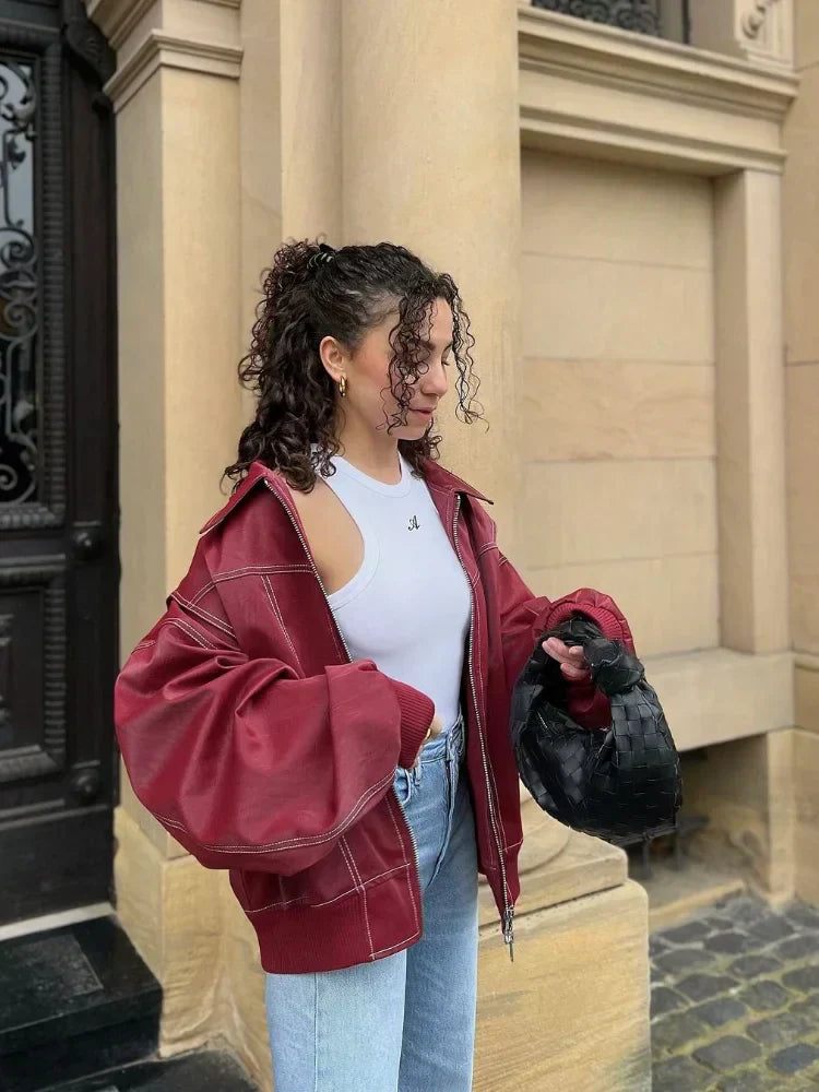 Stylish women's brown faux leather bomber jacket, oversized fit, perfect casual zip-up outerwear