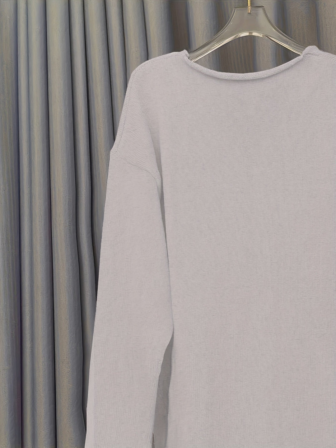 Cozy women's oversized V-neck patterned sweater for stylish autumn and winter layering.