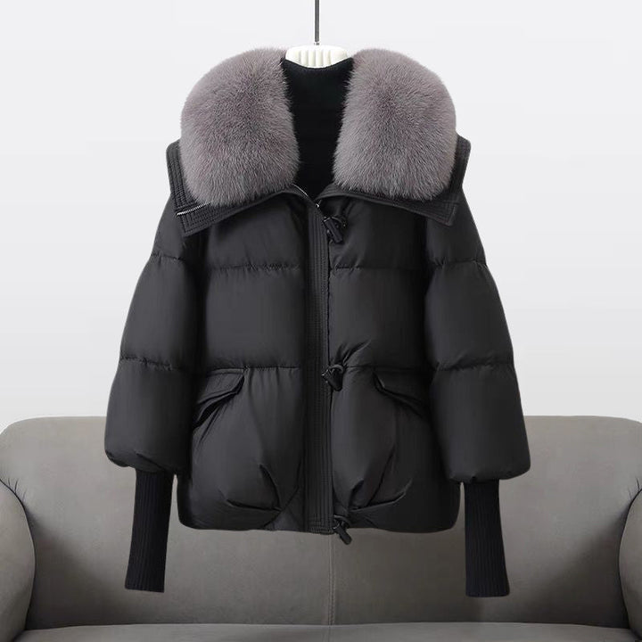 Women's padded winter jacket with fur collar, perfect for cold weather, front view.