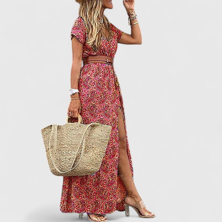 Vibrant paisley print women's maxi dress with a flattering V-neck, belted silhouette, and flowy side slit design.