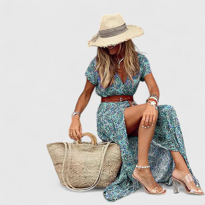 Comfortable V-neck women's paisley print maxi dress with short sleeves, belted waist, and trendy side slit.