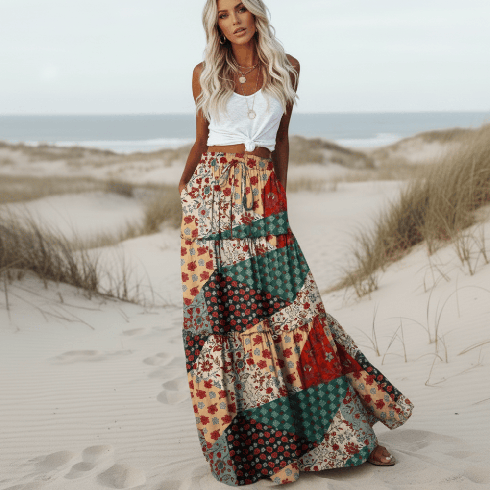 A-line long women's skirt featuring a vibrant patchwork floral print, ideal for casual summer vacation style.