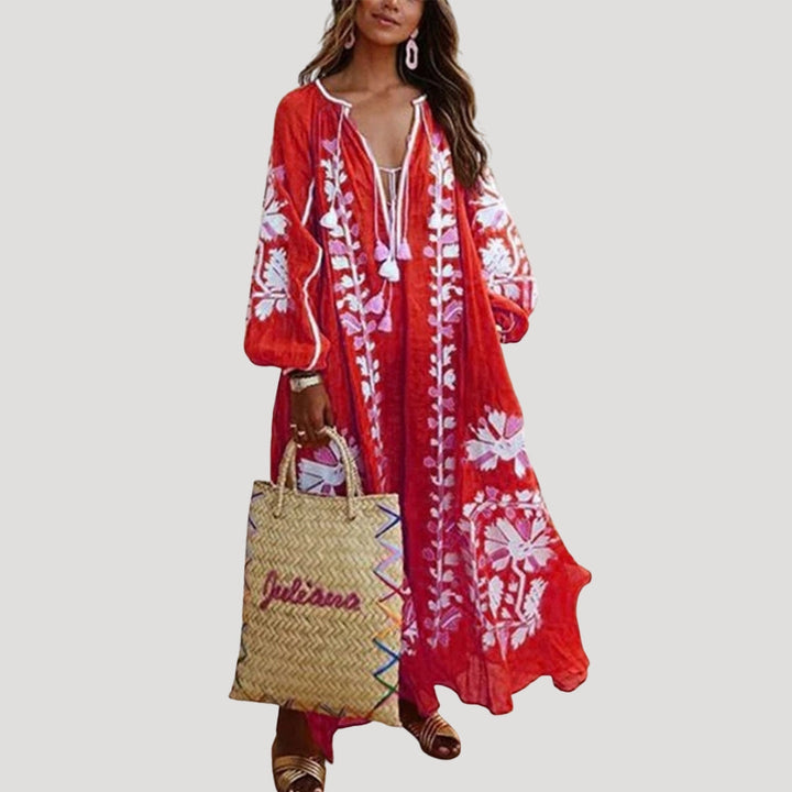 Women's patterned boho maxi dress with a V-neck and long sleeves, featuring a flowing, comfortable fit.