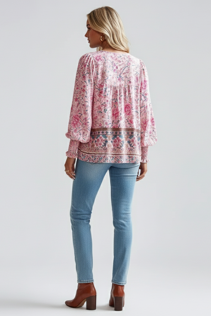 V-neck women's floral blouse with elegant long sleeves. Casual yet feminine top, perfect for spring fashion.