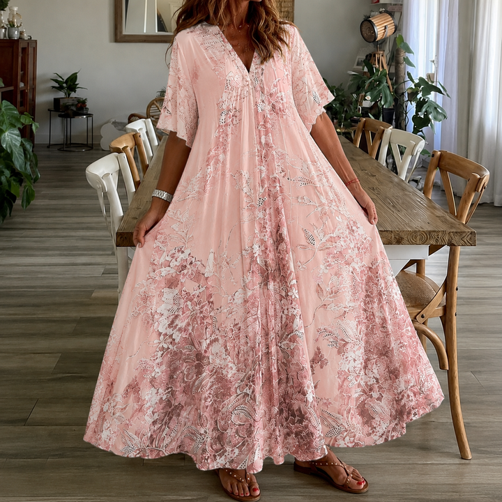 Casual women's pink floral print maxi dress for summer, featuring a flowy design and half sleeves.