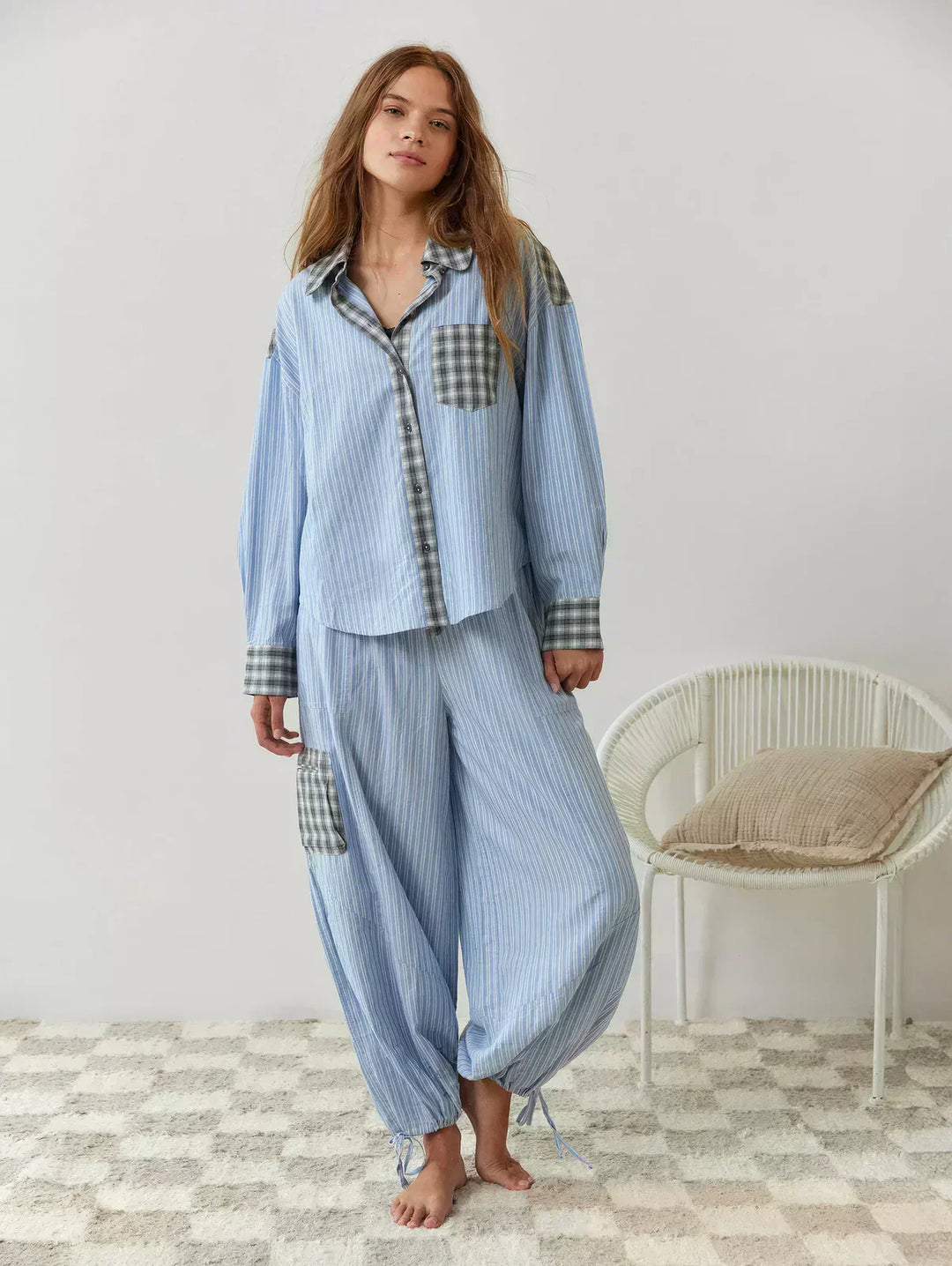 Flat lay of women's blue plaid matching set, top and pants, ideal for spring fashion