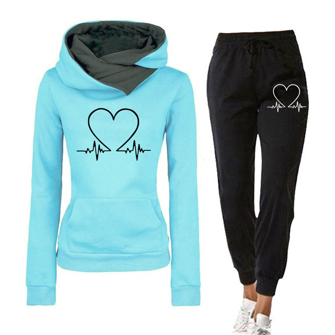 Casual grey women's athleisure tracksuit, relaxed fit hoodie & joggers with a subtle heart graphic, perfect for comfort.