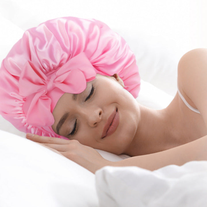 Close-up of the smooth silk satin fabric of a women's sleepcap bonnet in blue