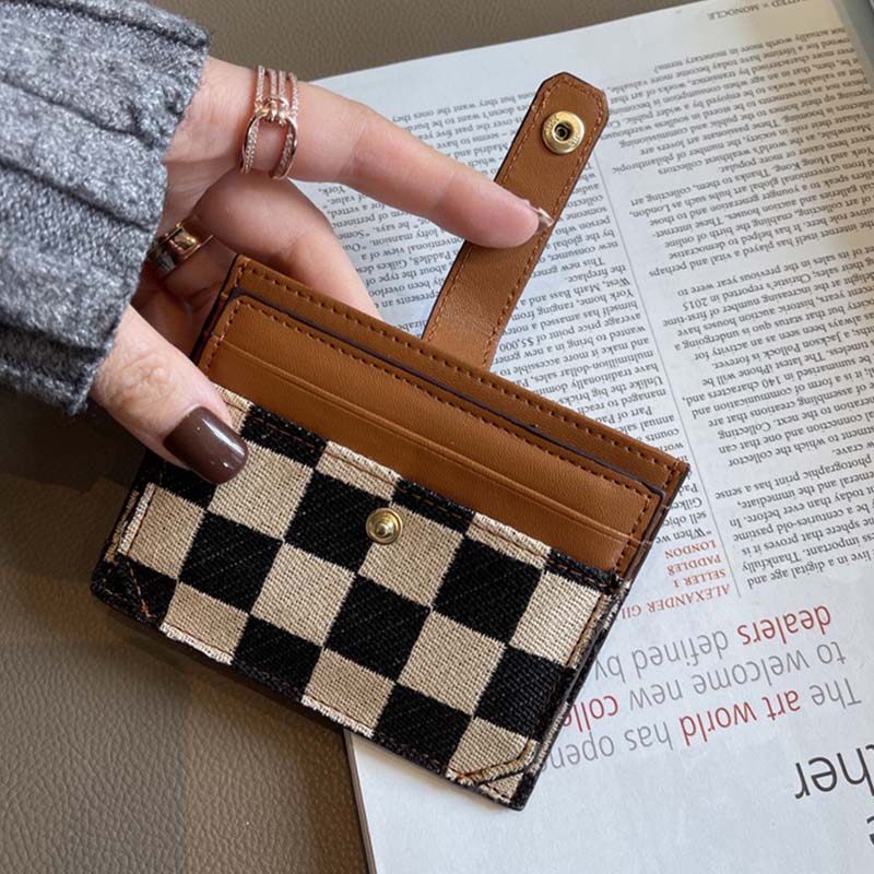 Top-down view of women's PU leather compact wallet, emphasizing square shape and design