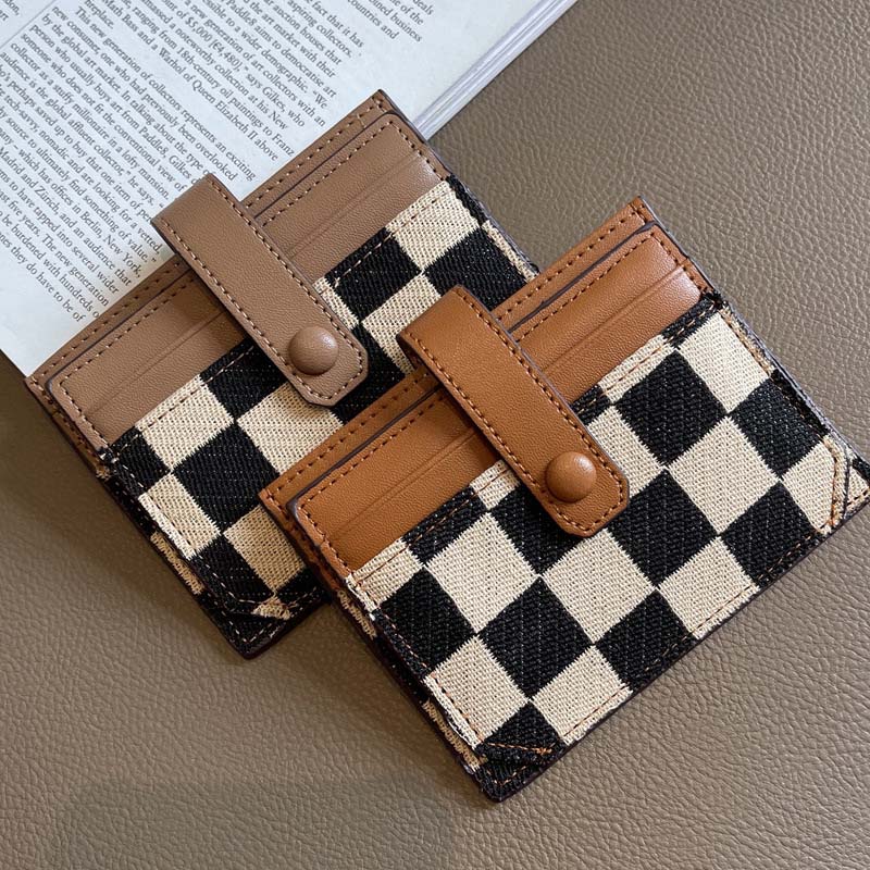 Open view of women's compact card holder wallet, revealing interior organization & zipper pocket