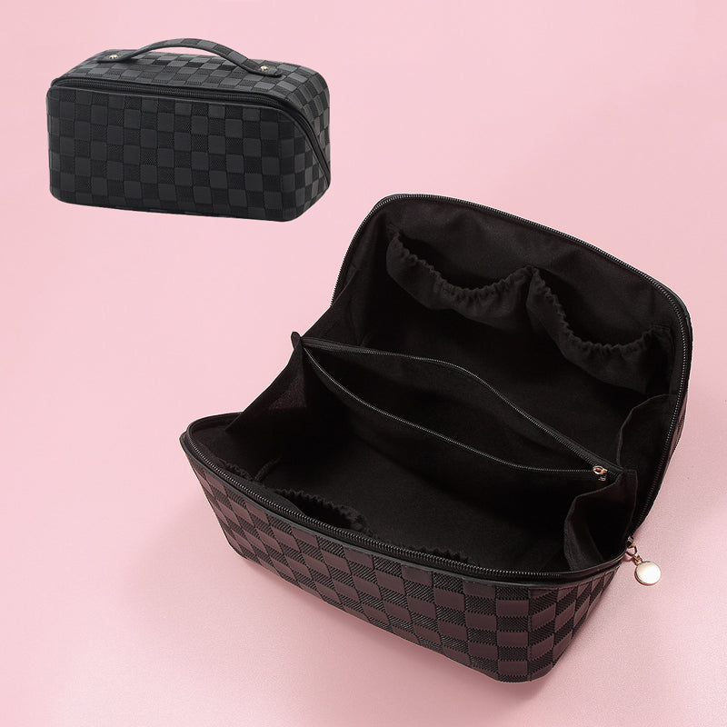 Side view of plaid travel makeup organizer, showing depth and capacity.