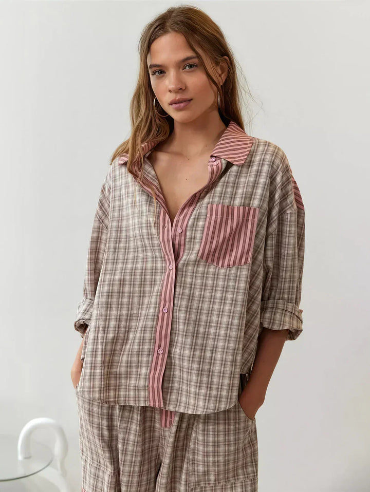 Women's plaid pajama set, cozy button-up long-sleeve top & relaxed fit pants for comfortable sleep.