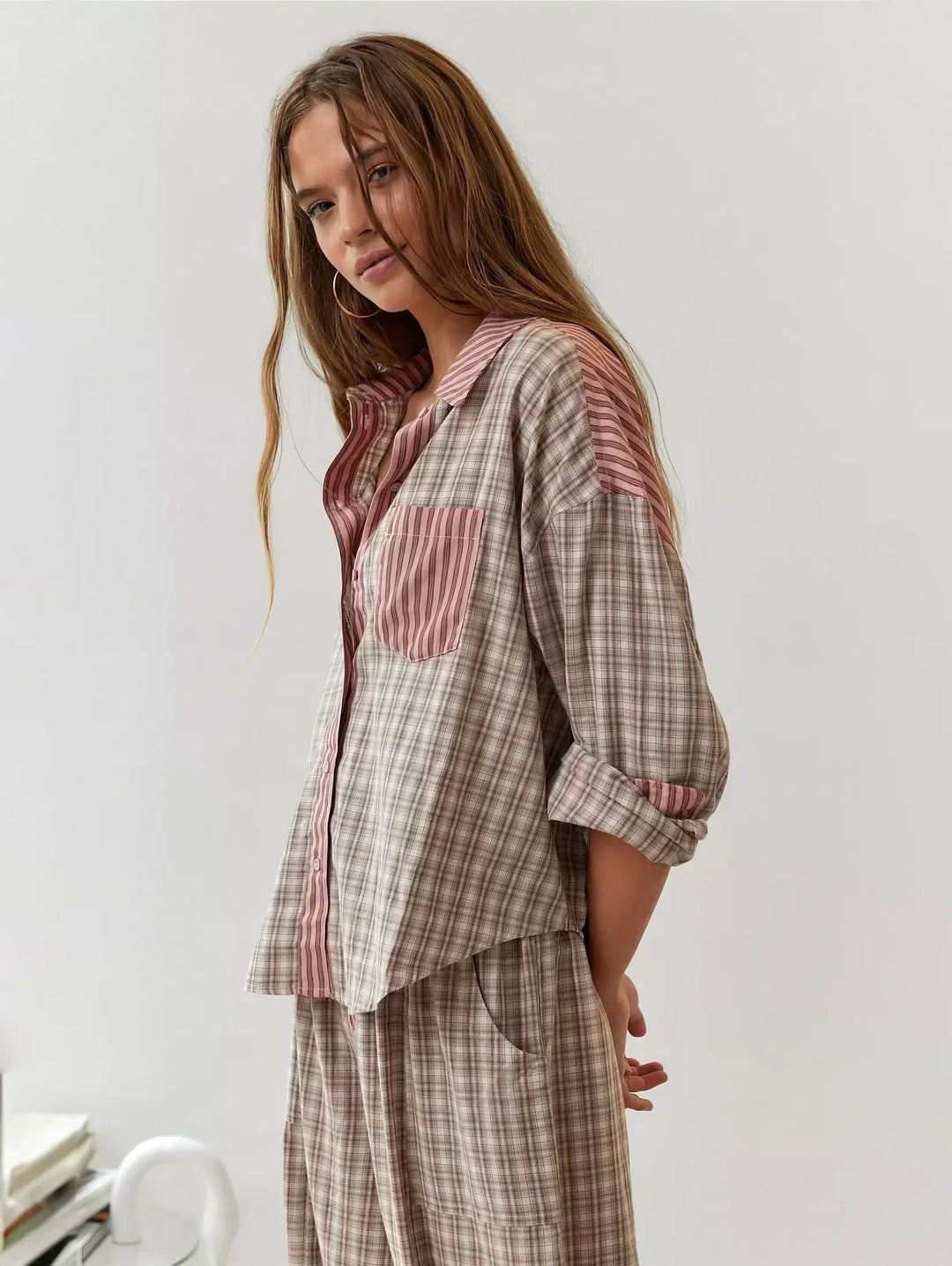 Comfortable women's plaid loungewear set with a button-up top and soft relaxed pants, perfect for home.