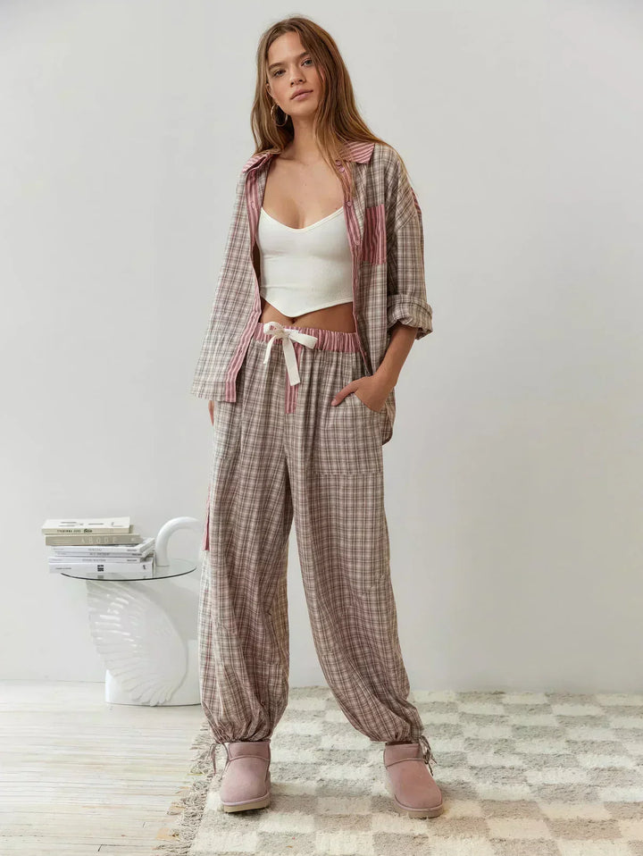 Cozy women's relaxed fit plaid sleepwear set with a classic button-up top & comfortable long pants.