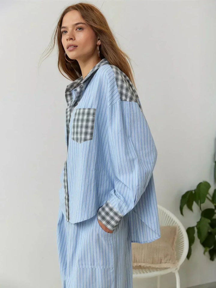 Women's comfortable plaid button-up pajama set with long-sleeve top and relaxed fit pants.