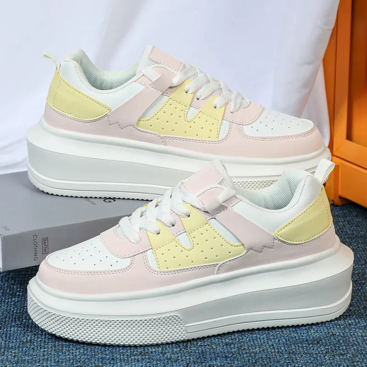 Trendy women's platform sneakers, perforated white design for breathability & all-day comfort. Lace-up style.