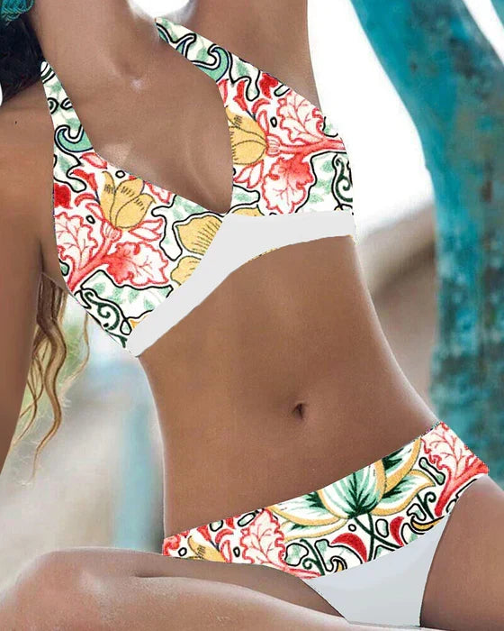 Playful women's floral & polka dot bikini. Stylish two-piece swimsuit for summer beach fun.