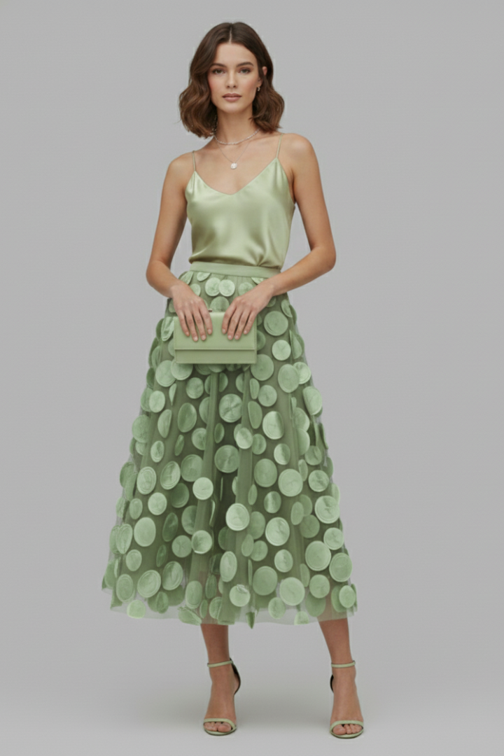 Voluminous women's full midi skirt with a playful polka dot pattern. Elegant and fashionable for her.