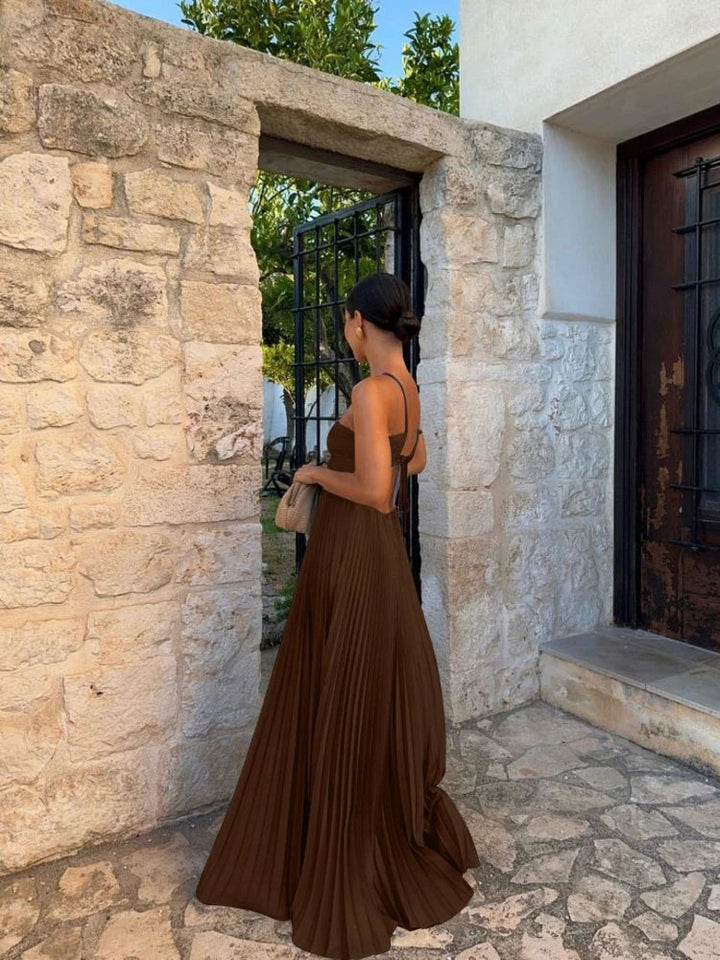 Beautiful women's pleated halter cutout maxi dress, an ideal choice for wedding guest attire.