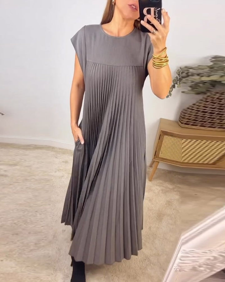Formal women's pleated maxi dress with sophisticated extended cap sleeves & empire waist.