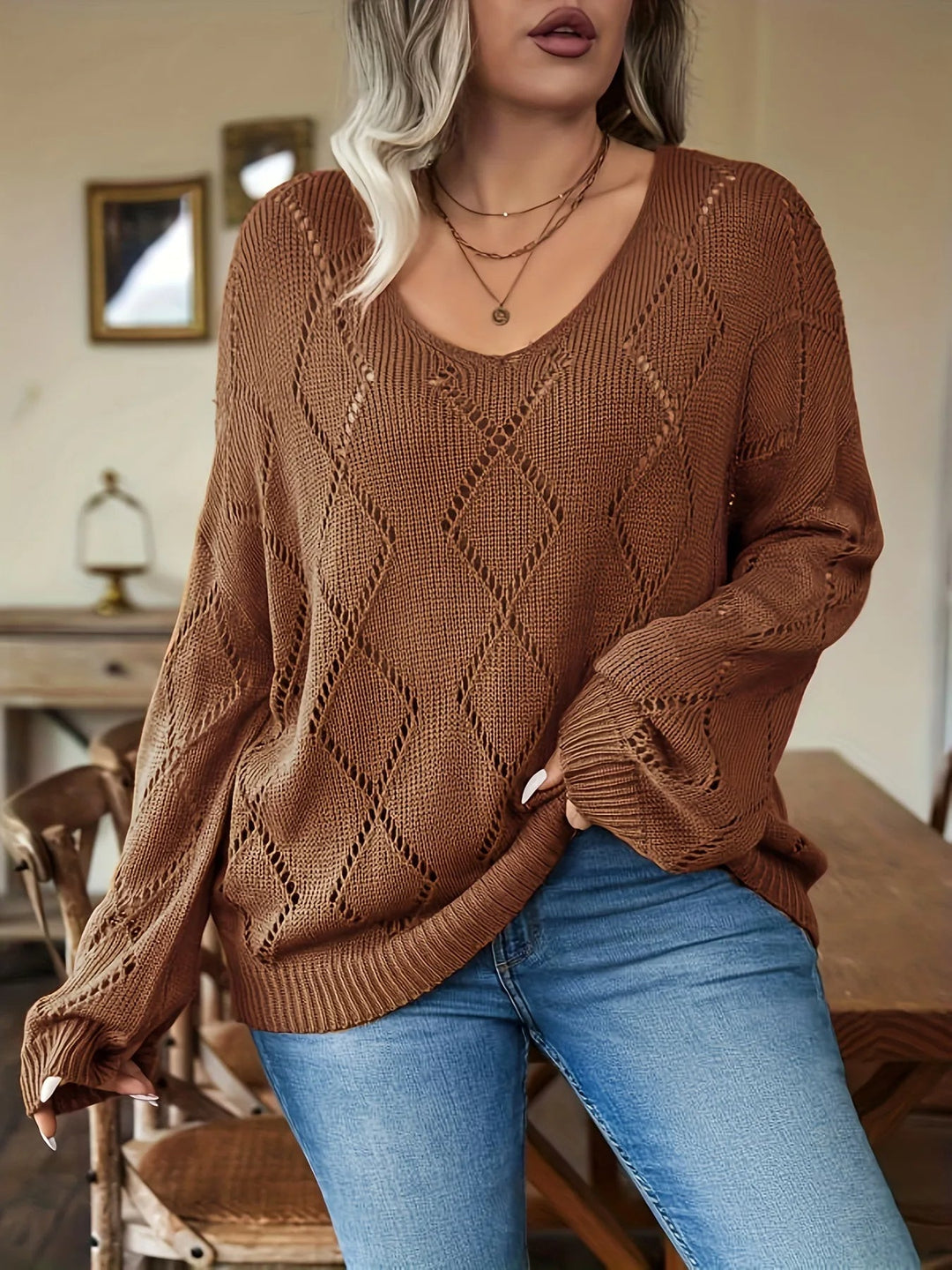 Women's plus size oversized knit sweater in brown. Cozy, chic, and comfortable for autumn & winter fashion.