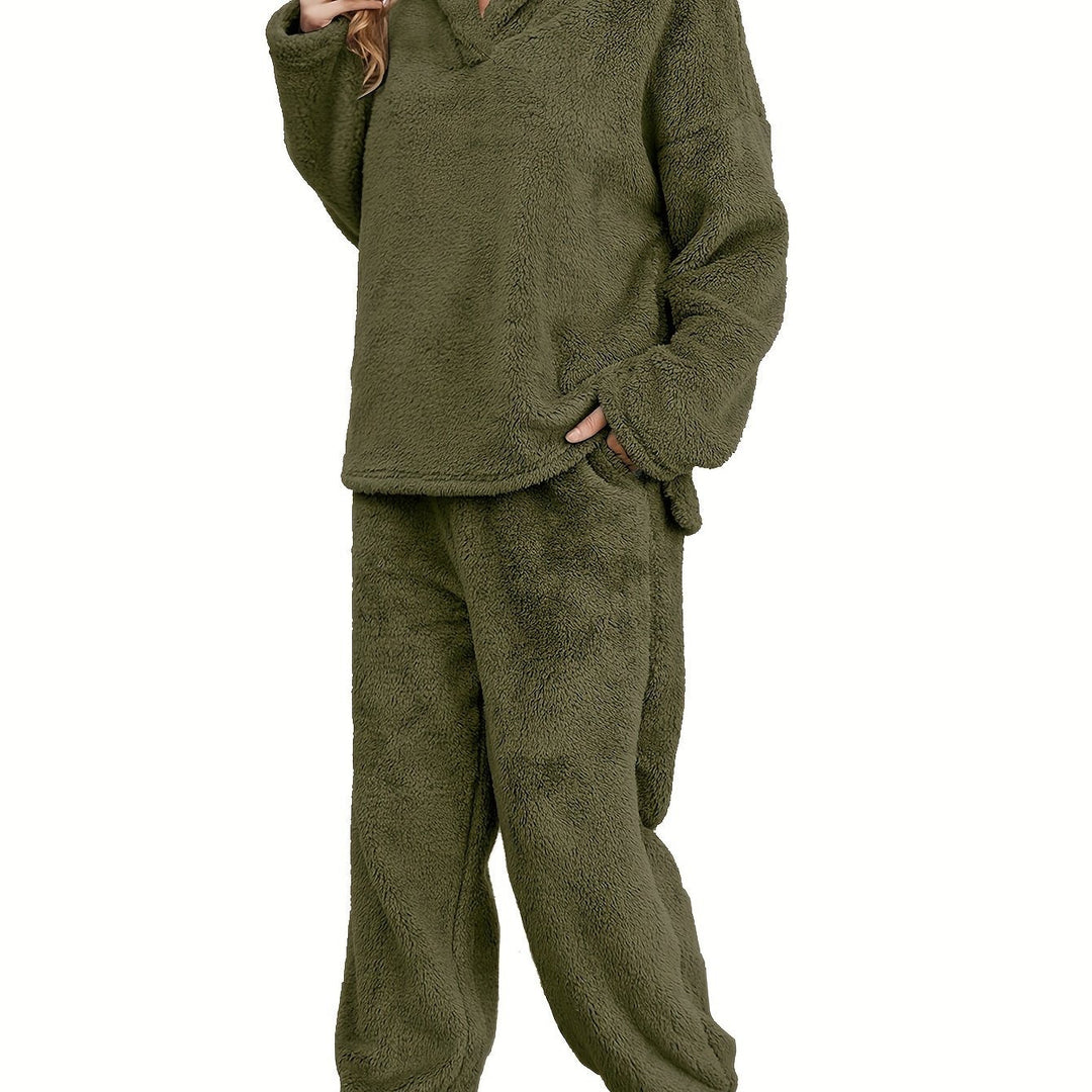 Cozy women's coral fleece loungewear top & pants set, ideal for warmth and comfort during cold seasons.