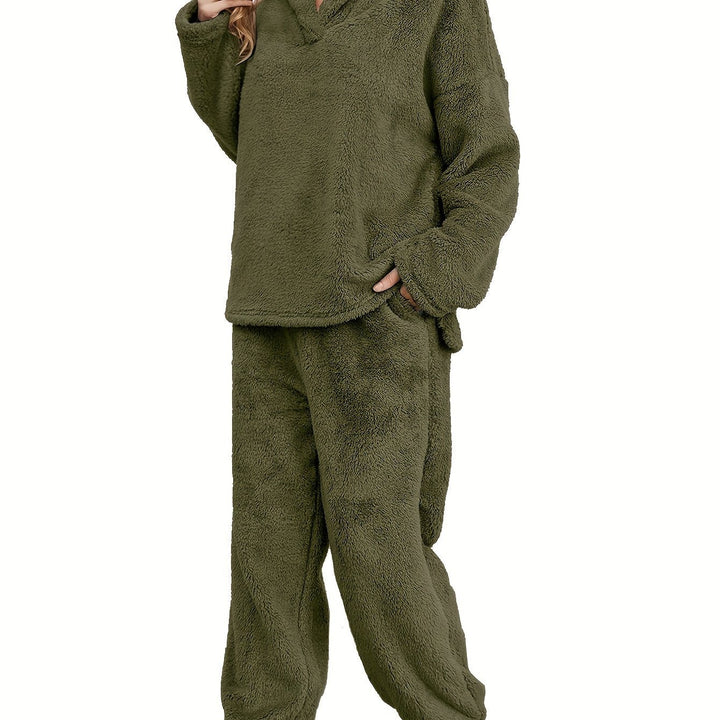 Cozy women's coral fleece loungewear top & pants set, ideal for warmth and comfort during cold seasons.